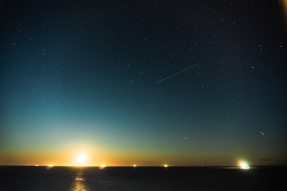 landscape photography of blue sea during golden hour