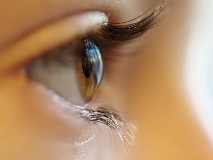Person holding eyeglasses — expert contact lens and glasses fitting at Jennings Opticians