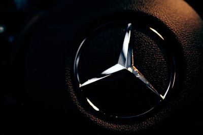 Close-up of a warrior-themed logo design glowing against a dark background.