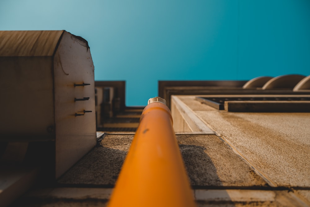 close-up photography of orange pipe