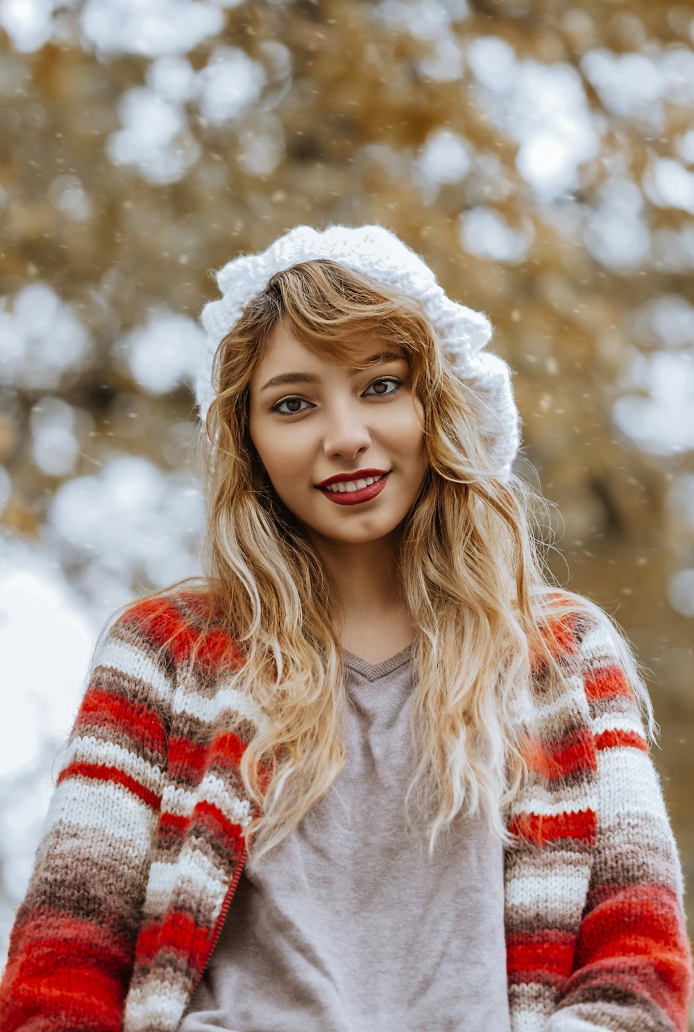woman in red and white sweater