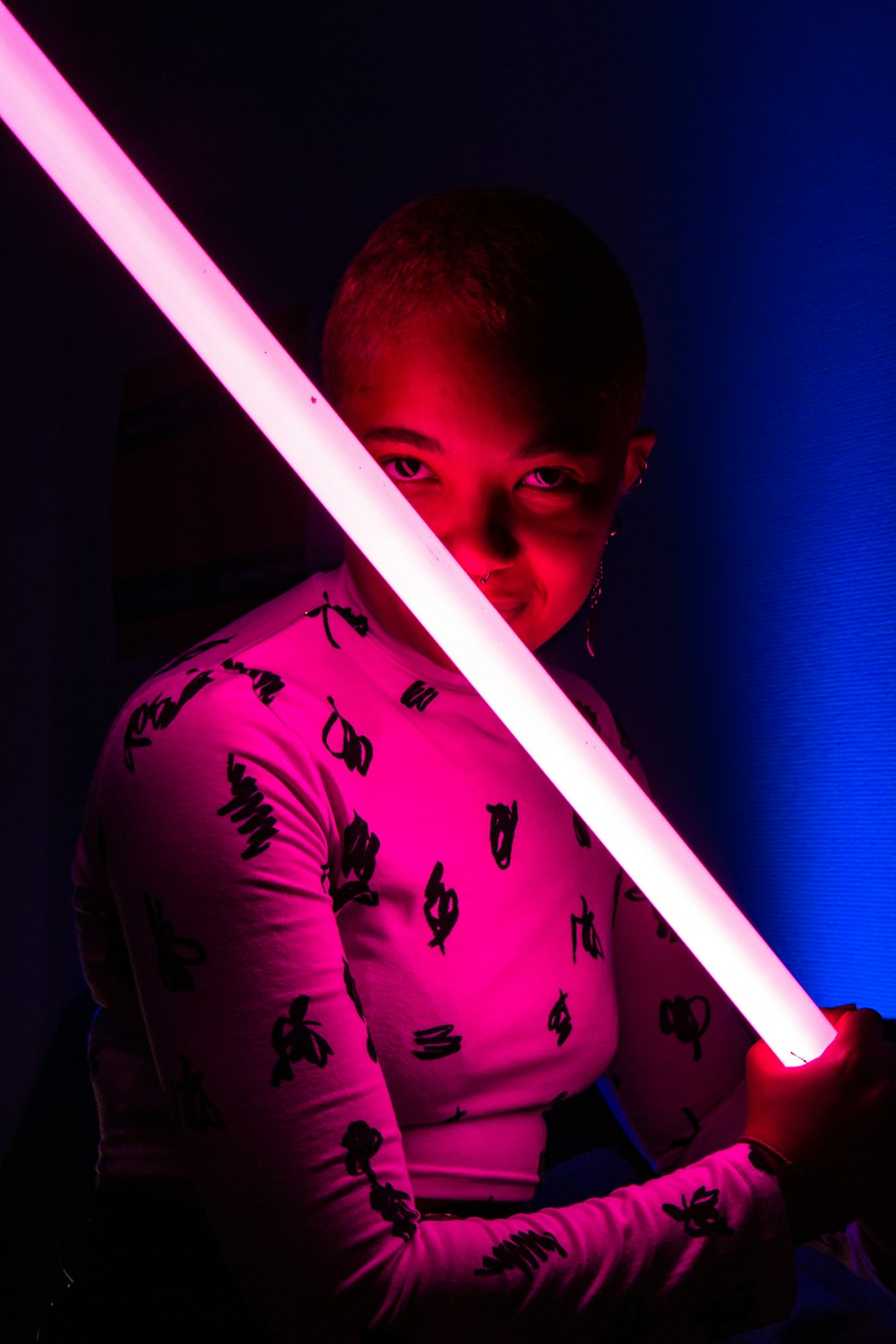 woman holding lightsaber