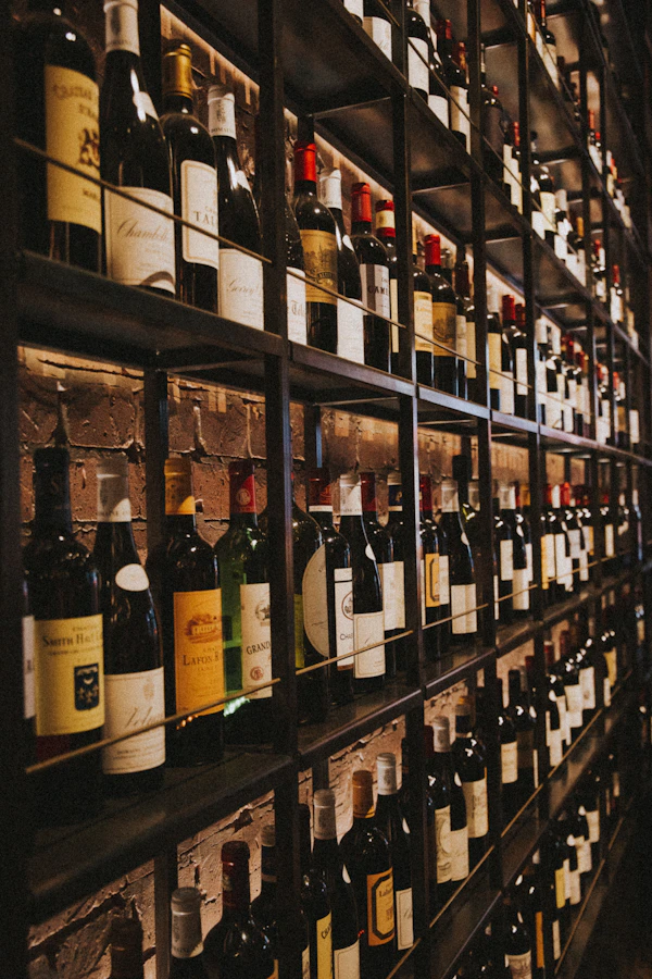 Wine bottles resting on a cellar rack