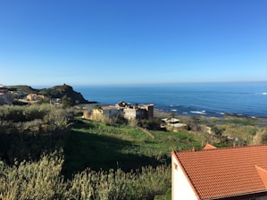 A scenic view of coastal homes in Galicia, showcasing the beauty of the Rías Baixas region.