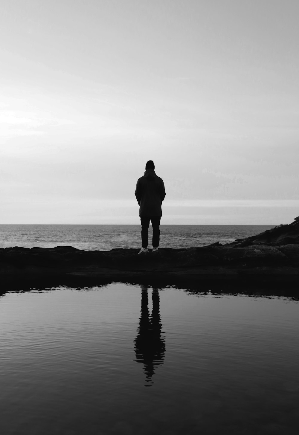 person standing in front of sea
