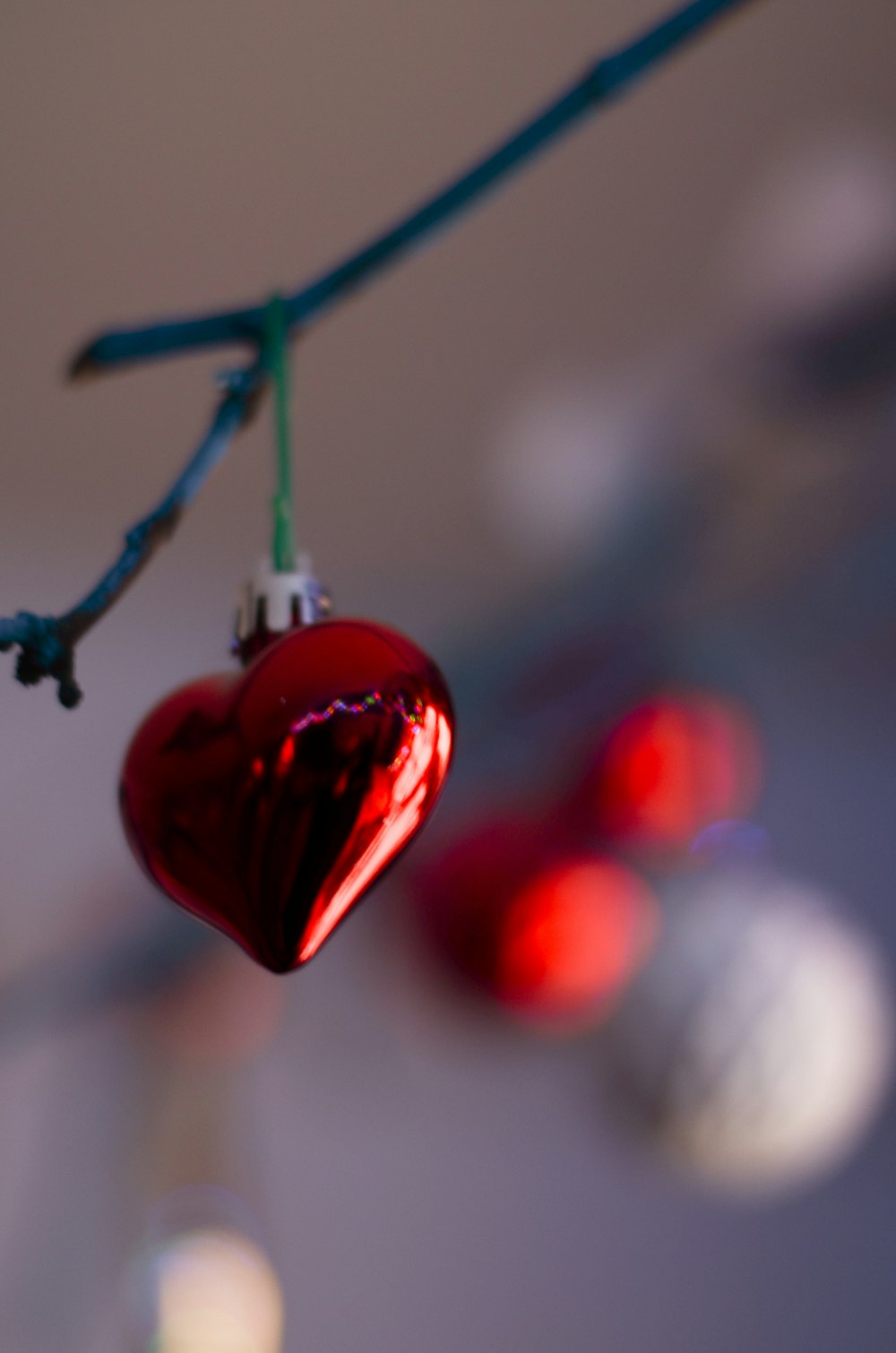 selective focus photo of red heart bauble