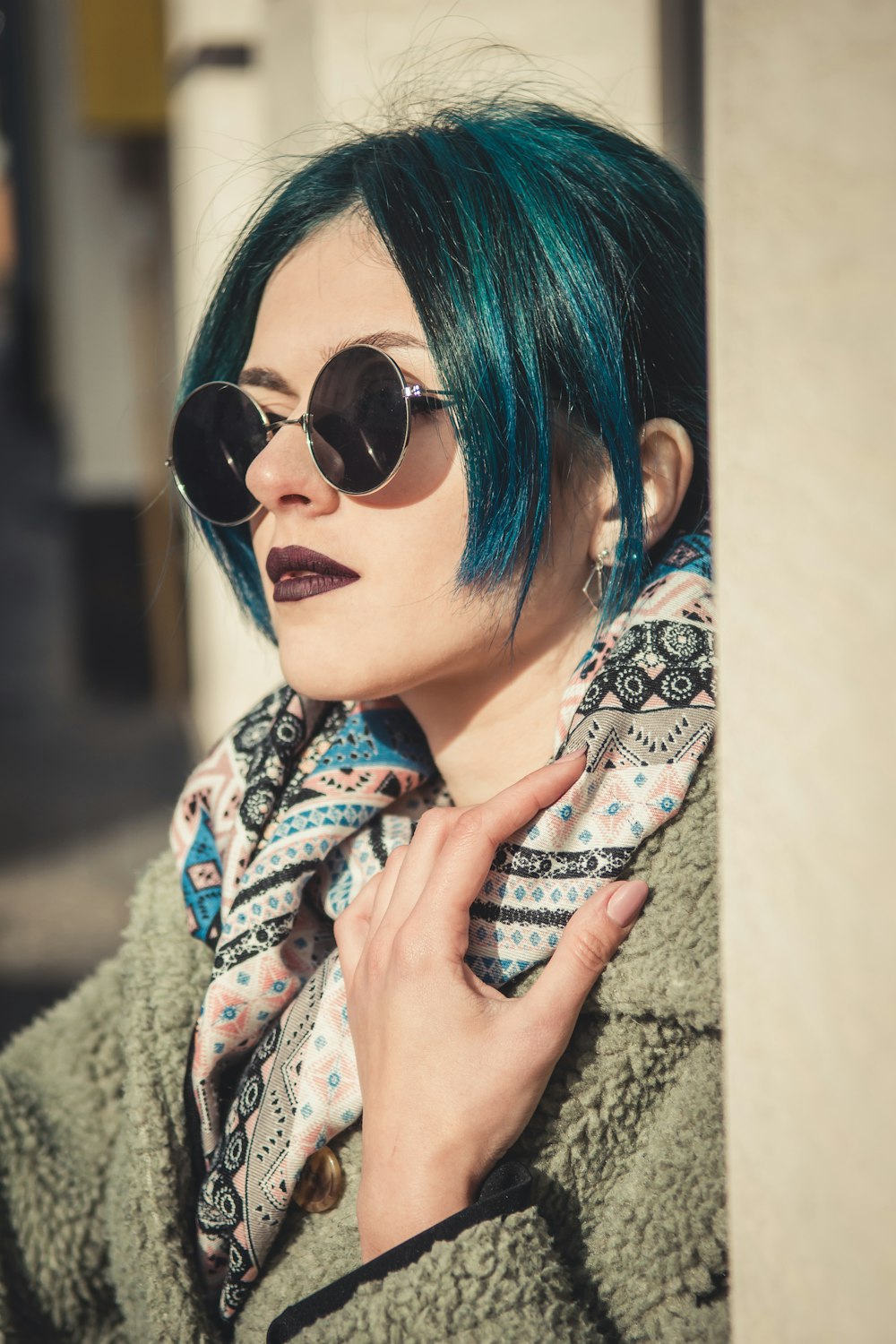 woman holding her scarf