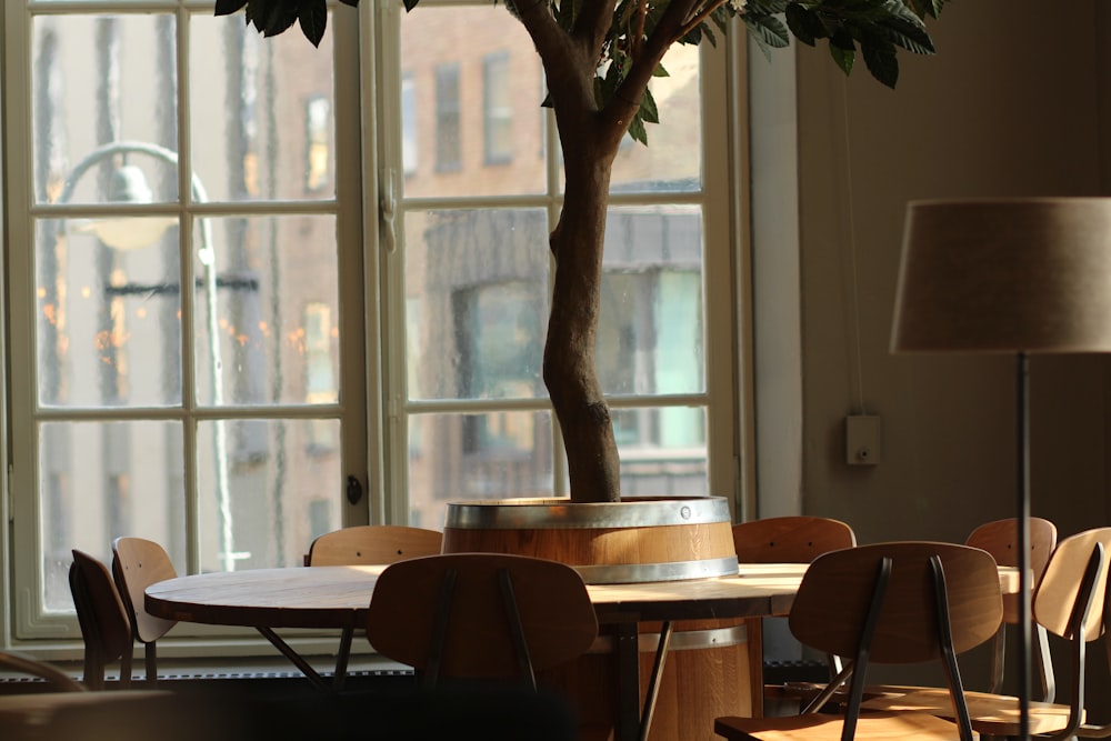 brown wooden barrel table with chairs