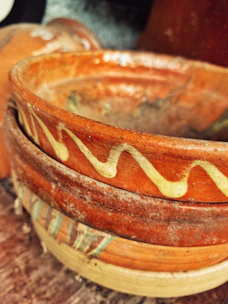 Artisan pottery bowls with unique patterns, perfect for daily use.