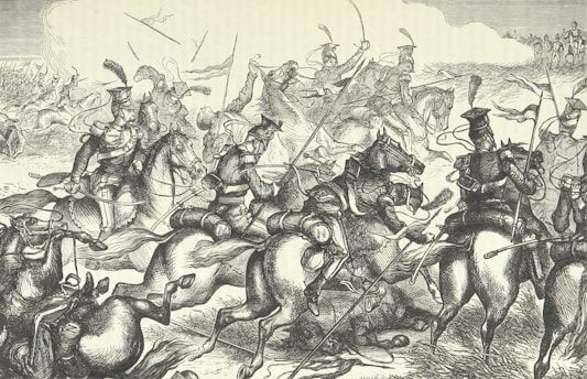 A detailed black and white illustration depicting a chaotic battle scene with numerous soldiers on horseback engaged in combat. The soldiers are wearing period military uniforms, with helmets and carrying weapons such as sabers and lances. The scene captures movement and intensity as the horses gallop and soldiers maneuver amidst smoke and dust.