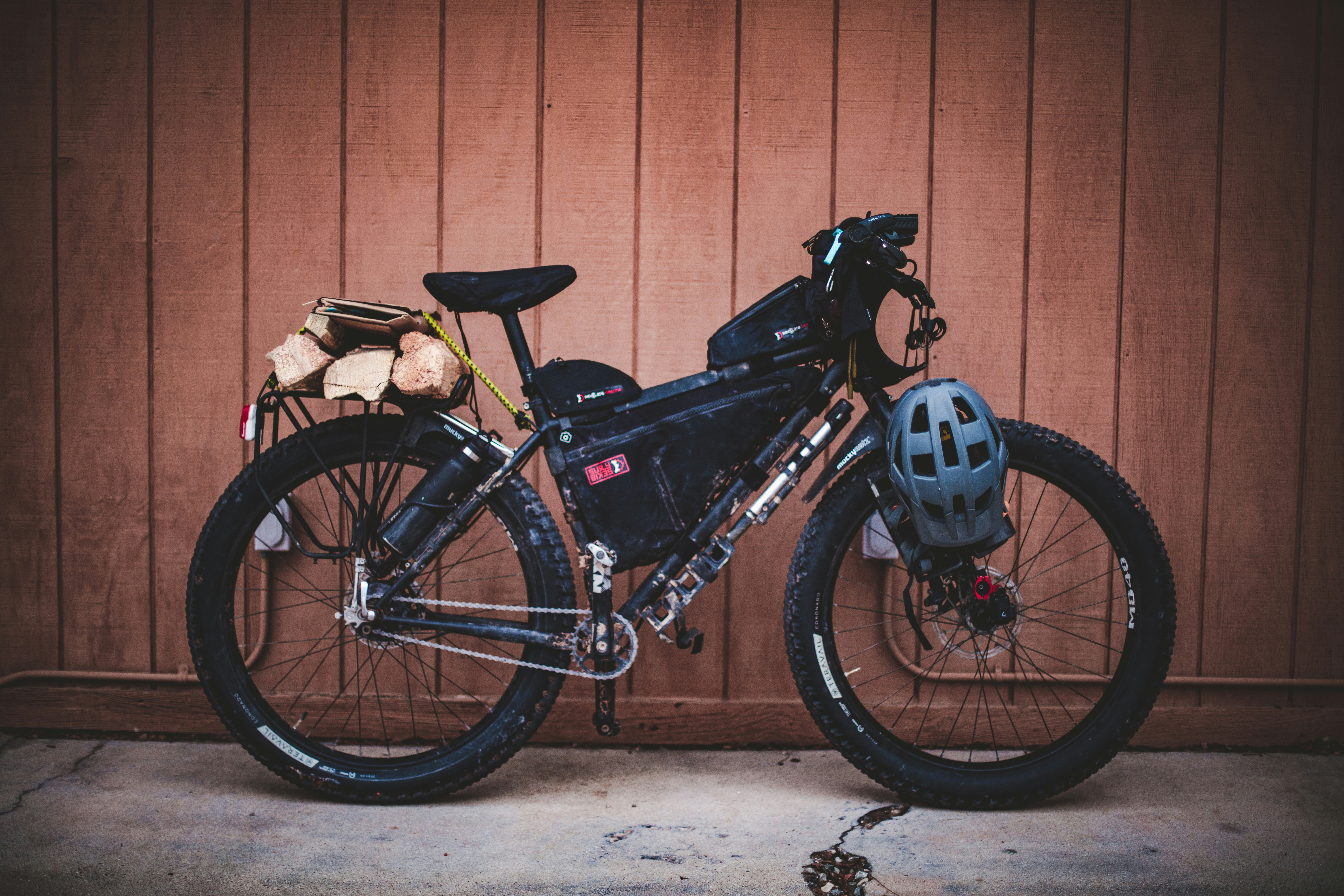 black bike beside wall