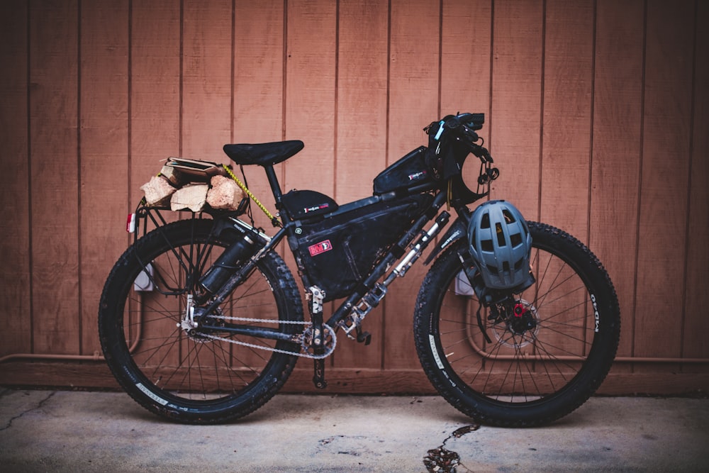 black bike beside wall