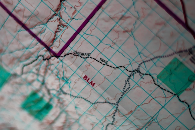 A close-up of a map with highlighted trails and project notes