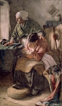 An elderly woman with a shawl comforts a younger woman who is seated and appears distressed, covering her face with her arm. The scene is set in a modest, dimly lit room with simple furnishings and textiles.