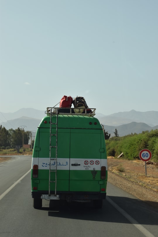 green and white van on road in Marrakech Morocco