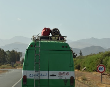 green and white van on road