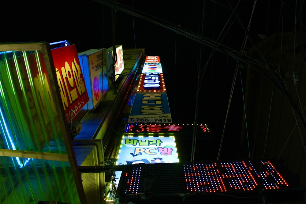 low angle photography of turned-on light signage