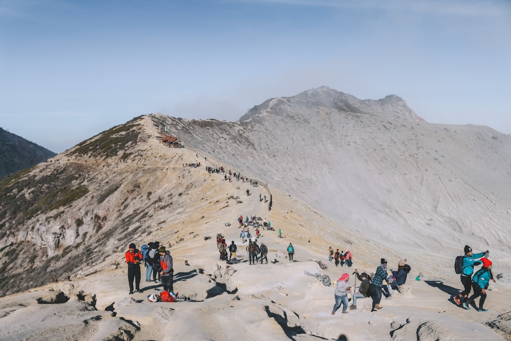 a group of people hiking up a mountain