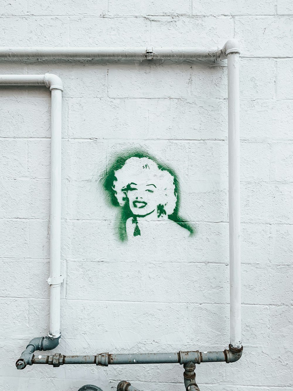 Marilyn Monroe graffiti on white wall