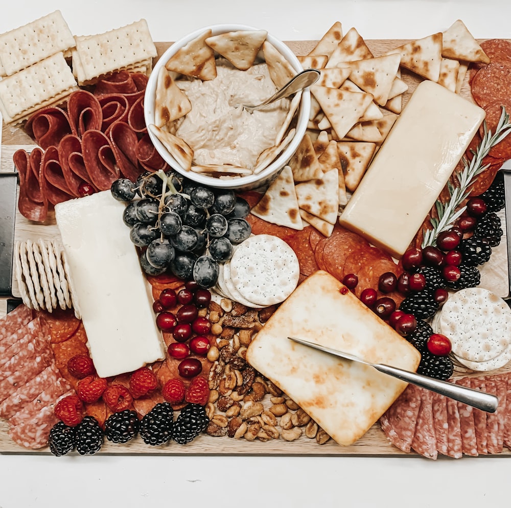 variety of fruits, bowl of pastries and cheese