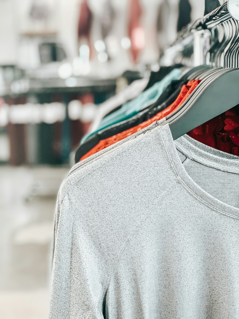 white crew-neck shirt on hanger