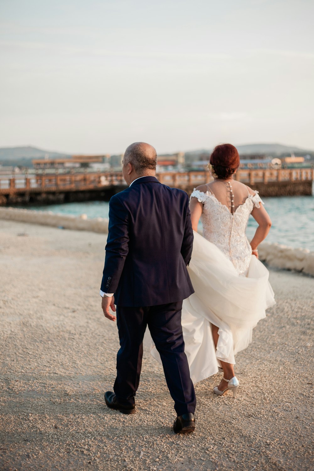 wedding couple walking on beach