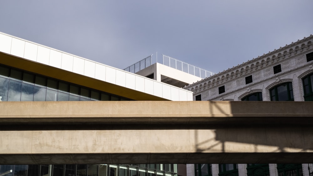 a view of a building and a bridge in front of it