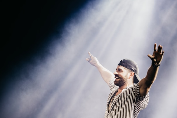 A candid moment of Paco smiling backstage before a prestigious concert.