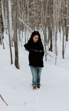 woman in black shirt standing on snow