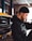 selective focus photography of man standing near vehicle