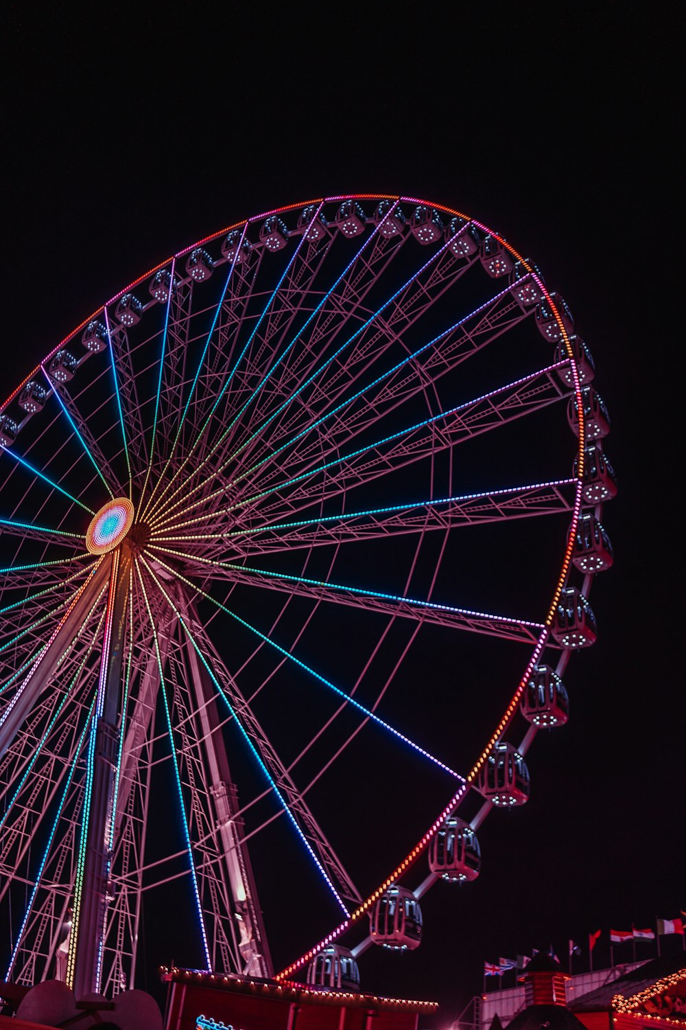 a large ferris wheel lit up at night