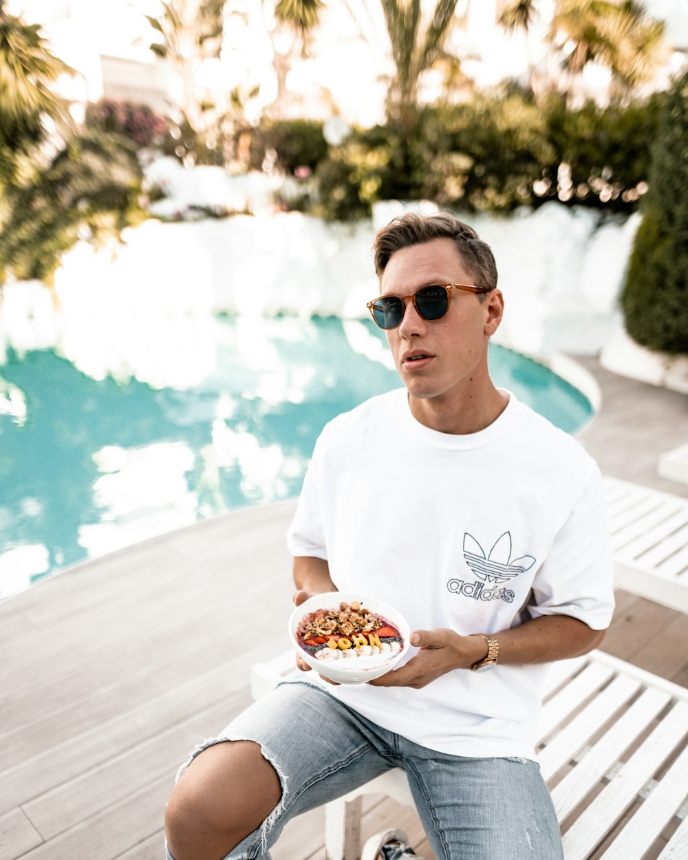 man holding bowl of food