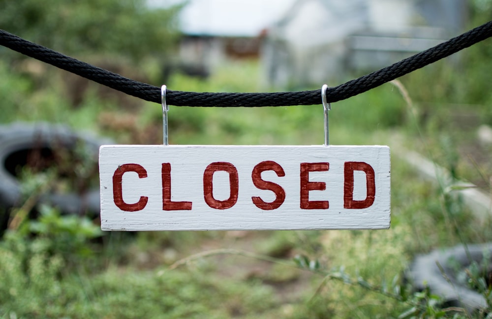 closed sign on string