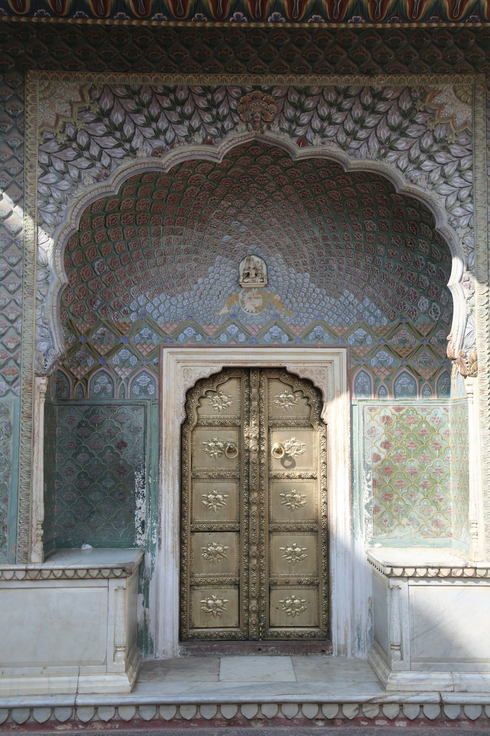 closed gray and blue door during daytime