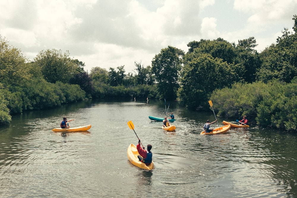 unknown persons riding on kayaks