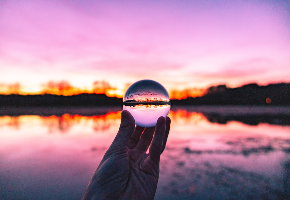 person holding crystal ball