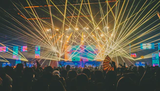 Crowd enjoying a vibrant live AI-powered music concert with colorful stage lights.