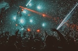 crowd partying with red stage lights