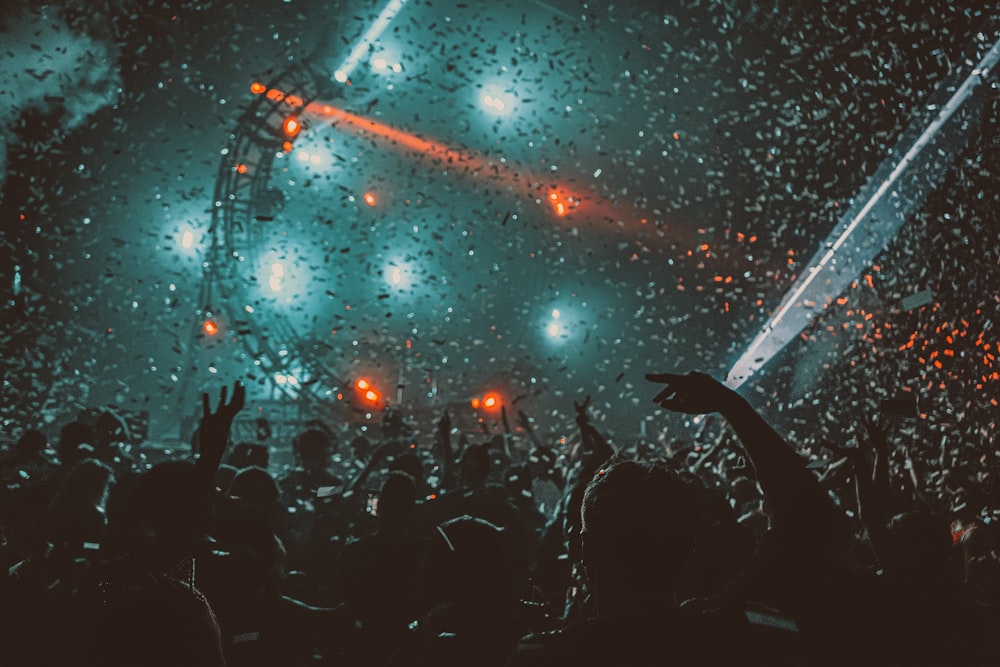 crowd partying with red stage lights