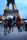 Happy group of friends posing in front of the Eiffel Tower in Paris