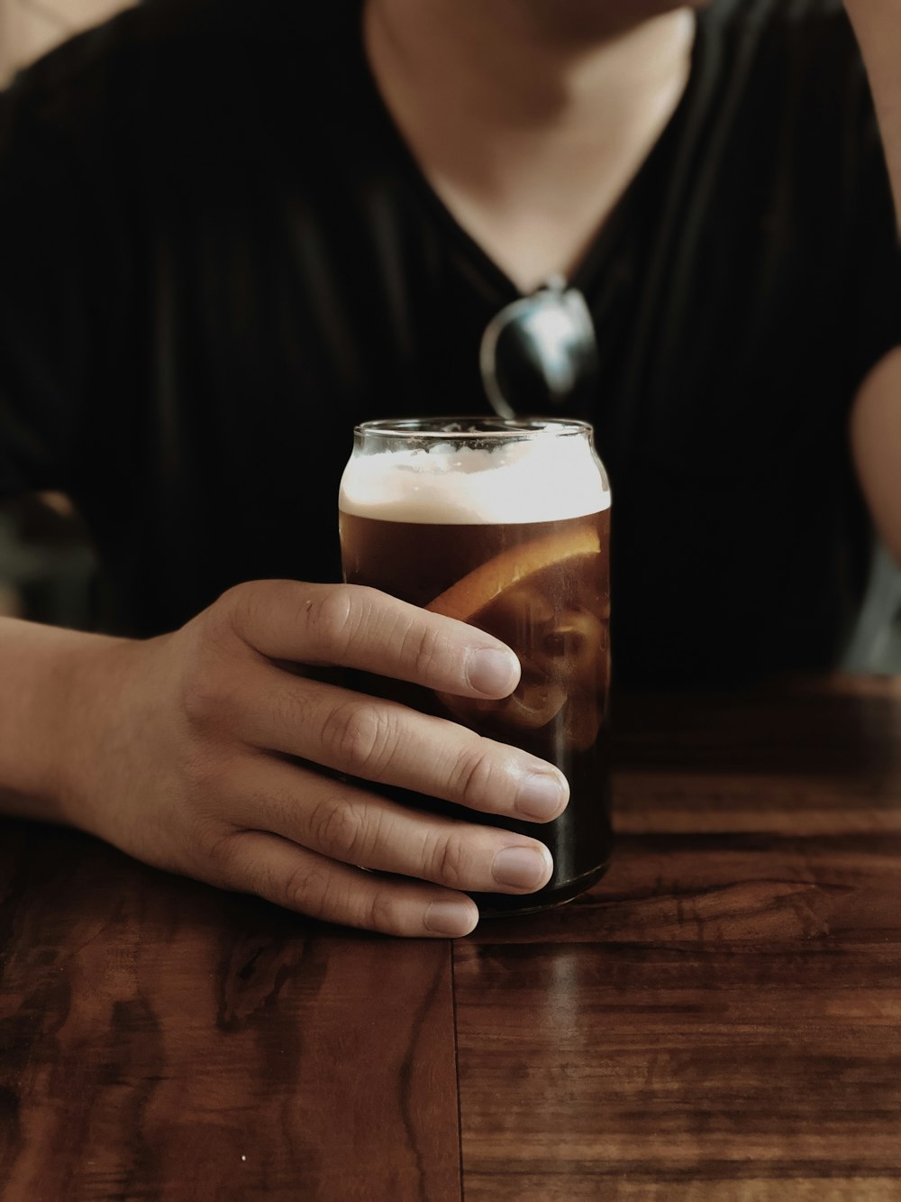 unknown person holding cup of soda