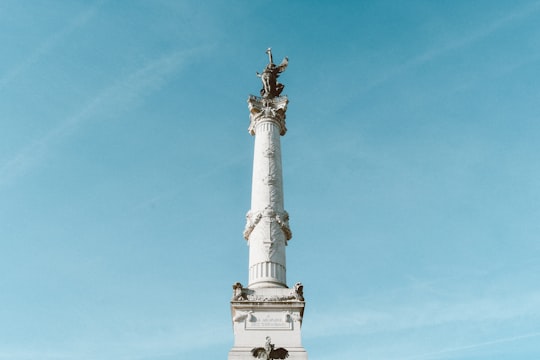 architectural photography of white post in Girondins Monument France