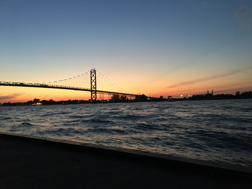 suspension bridge above body of wateer