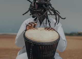 man playing percussion drum