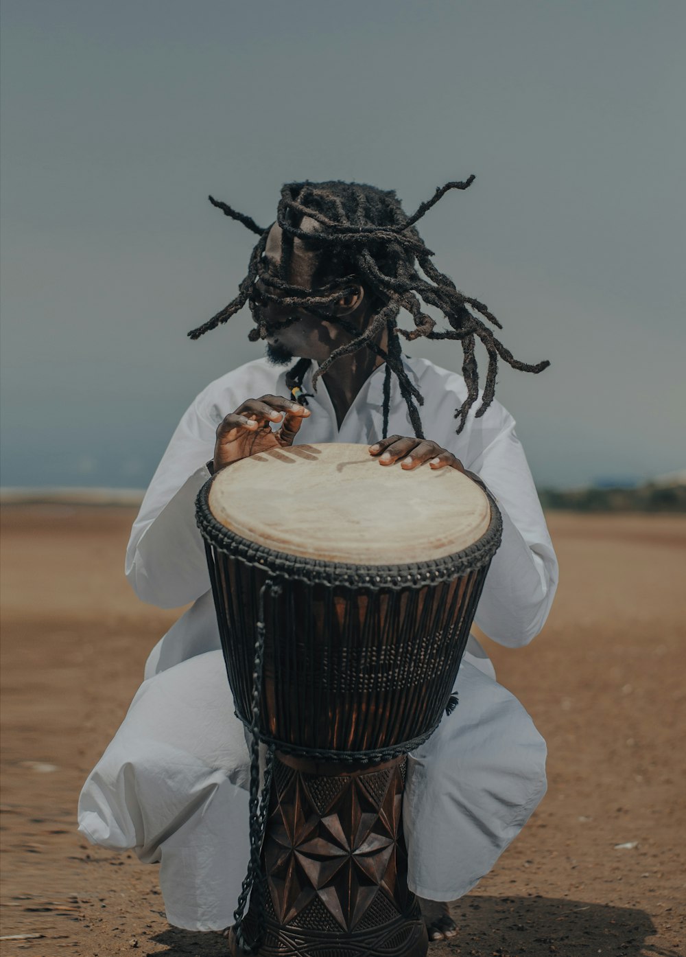man playing percussion drum