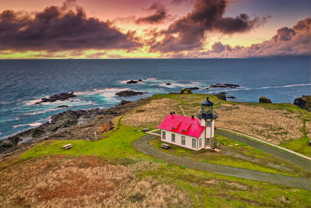 red roofed house near sea