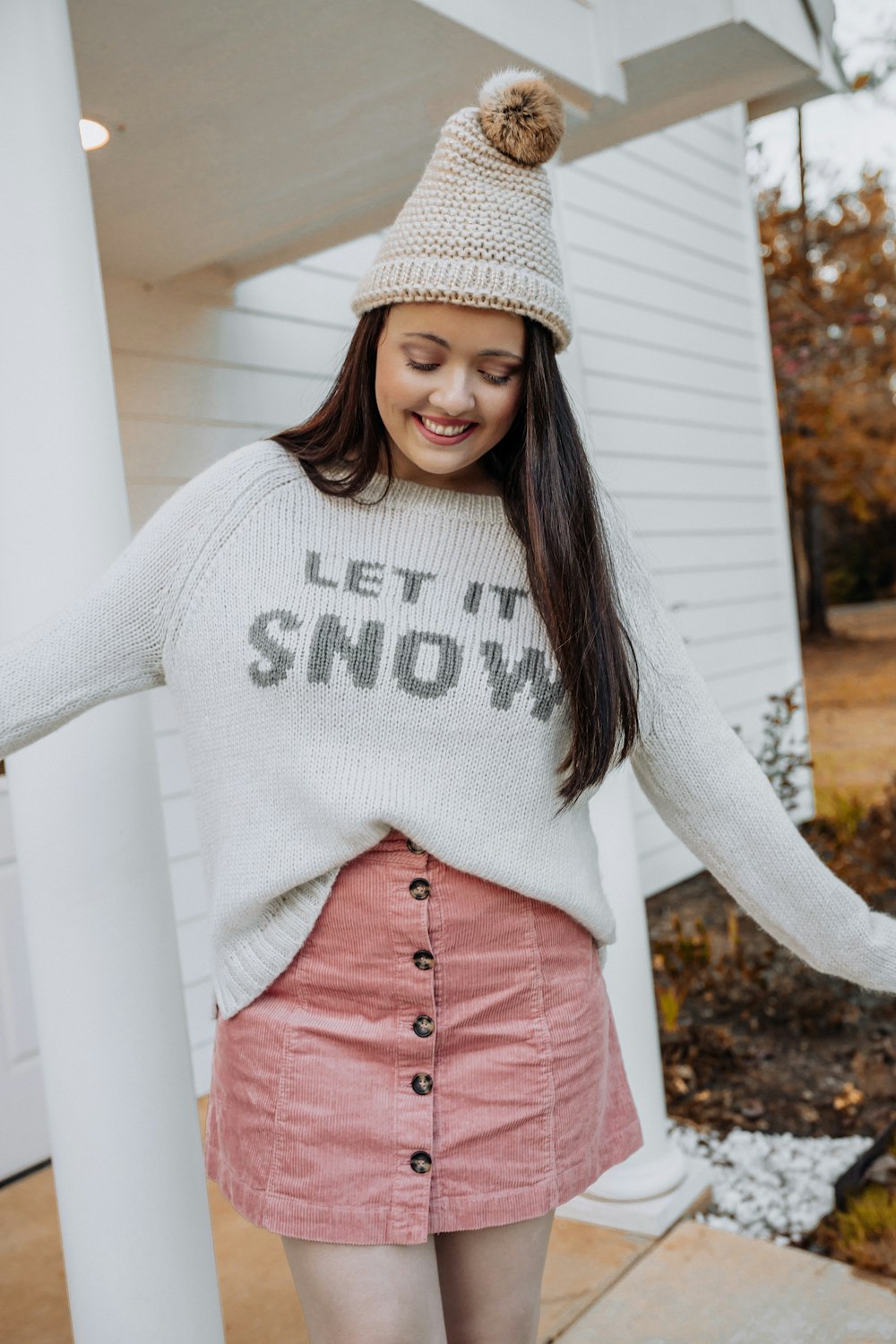 woman wearing white sweater