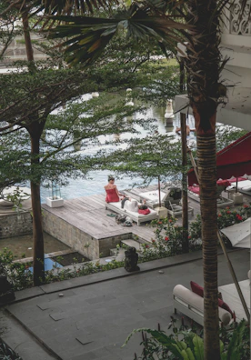 A serene outdoor scene with a person enjoying a moment of calm, surrounded by Verdevibe branded items.