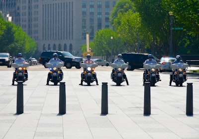 six men riding motorcycles washington teams background