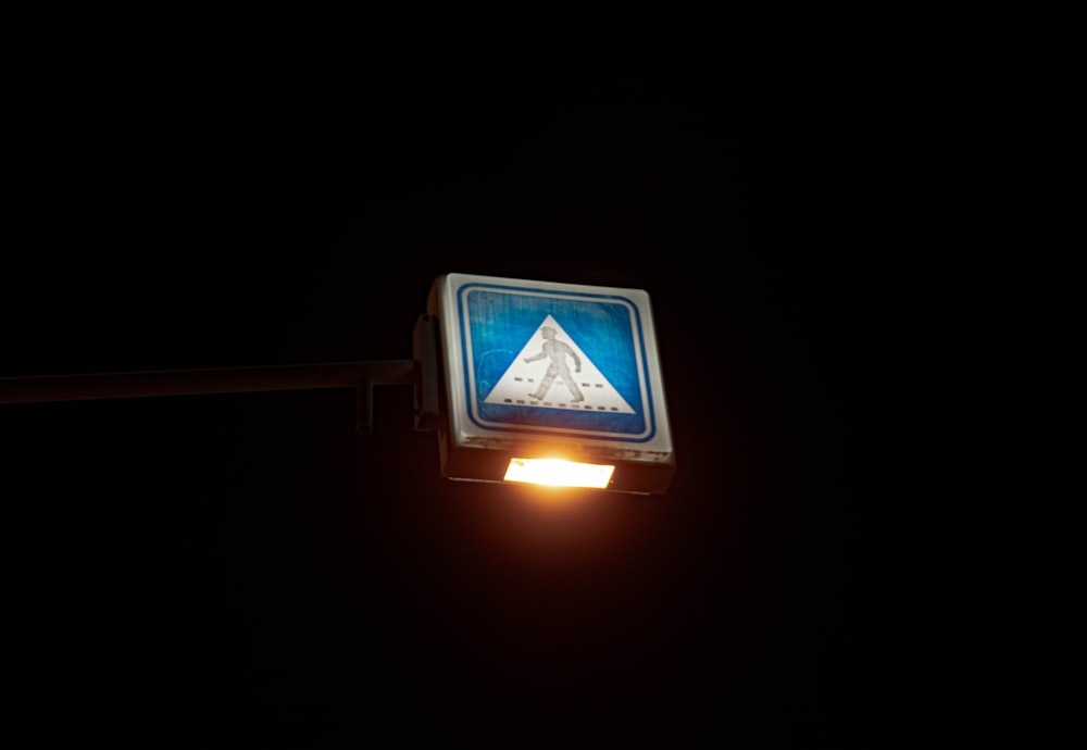 walk sign turned on during night